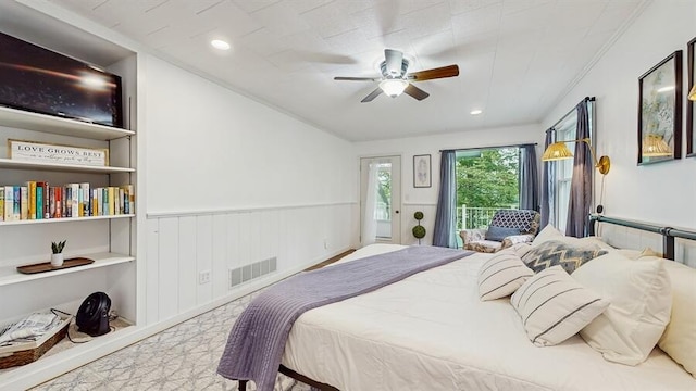 14883 Hideaway Dr, Vandalia, MI 49095 - bedroom with access to outside, wainscoting, a ceiling fan, and recessed lighting