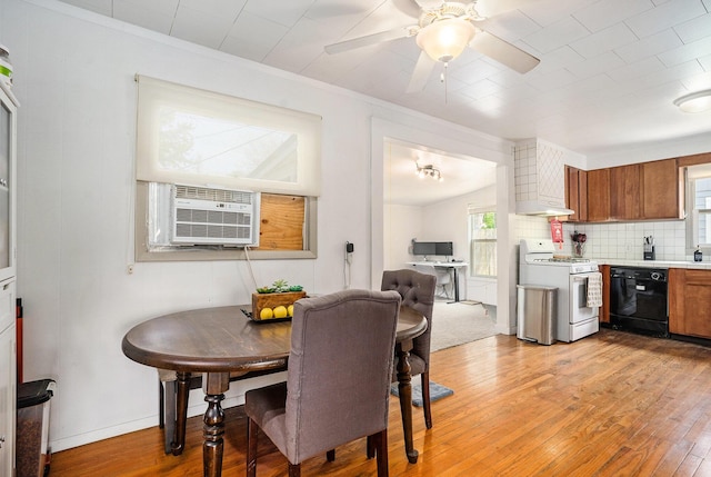 734 Hiways Ave, South Haven, MI 49090 - dining area featuring light wood-style flooring, a ceiling fan, cooling unit, baseboards, and ornamental molding