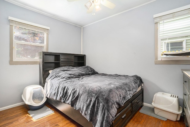 734 Hiways Ave, South Haven, MI 49090 - bedroom featuring crown molding, baseboards, multiple windows, and wood finished floors