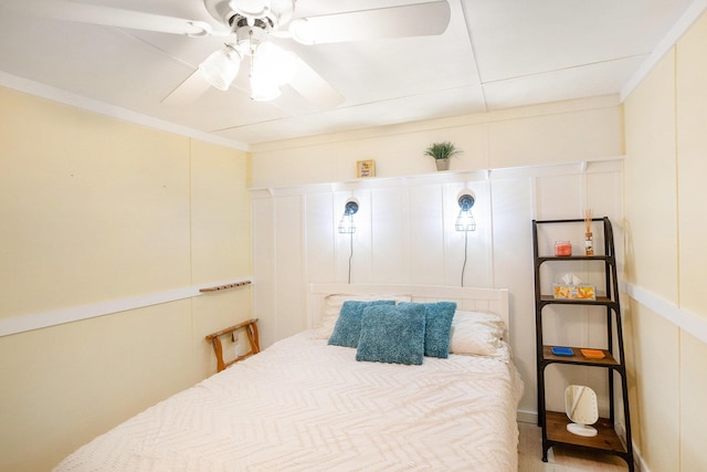 6026 Keeney Rd, Six Lakes, MI 48886 - bedroom featuring ceiling fan, ornamental molding, and a decorative wall