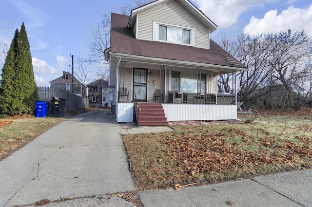 760 Algonquin St, Detroit, MI 48215 - view of front facade with a porch, driveway, and roof with shingles