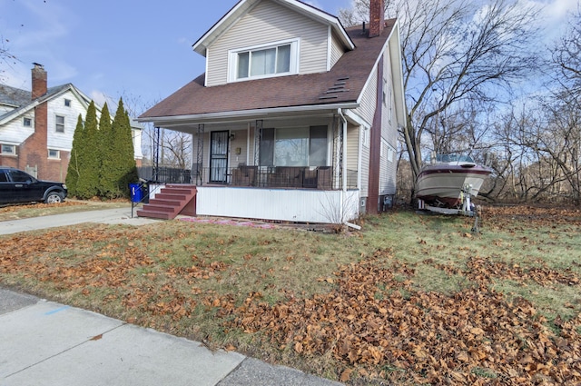760 Algonquin St, Detroit, MI 48215 - bungalow featuring covered porch, a chimney, roof with shingles, and a front yard