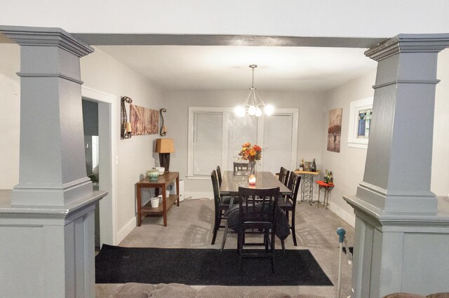760 Algonquin St, Detroit, MI 48215 - dining area featuring light carpet, decorative columns, a chandelier, and baseboards