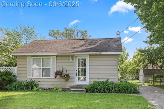 501 Front St, Holly, MI 48442 - view of front facade with a shingled roof