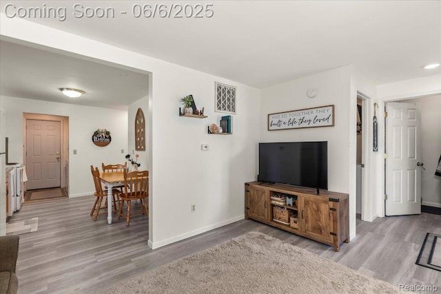 501 Front St, Holly, MI 48442 - living room with wood finished floors and baseboards