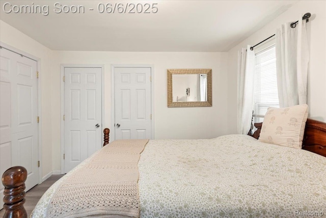 501 Front St, Holly, MI 48442 - bedroom with dark wood-style floors and baseboards