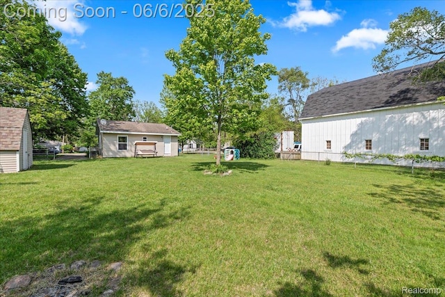501 Front St, Holly, MI 48442 - view of green lawn with an outdoor structure