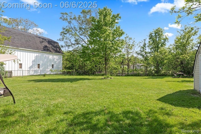 501 Front St, Holly, MI 48442 - view of grassy yard with a barn and an outdoor structure