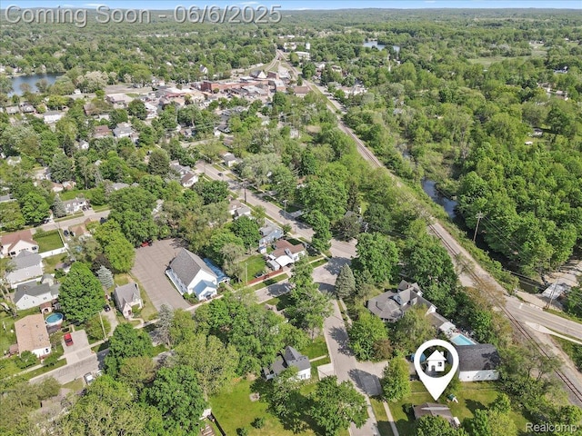 501 Front St, Holly, MI 48442 - view of property location featuring nearby suburban area, a large body of water, and a forest