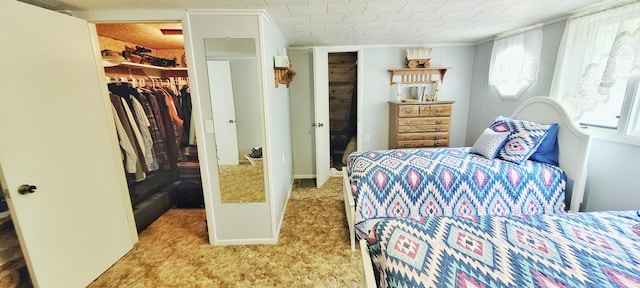 1308 Beaver Rd, Bitely, MI 49309 - carpeted bedroom featuring a spacious closet and a closet