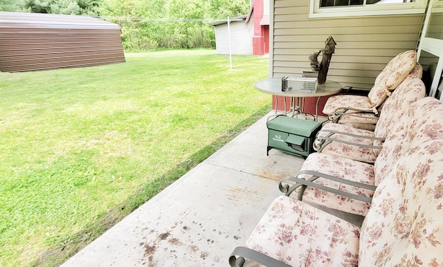 1308 Beaver Rd, Bitely, MI 49309 - view of green lawn featuring a patio