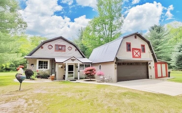 1308 Beaver Rd, Bitely, MI 49309 - dutch colonial featuring a gambrel roof, a barn, an outbuilding, and a detached garage