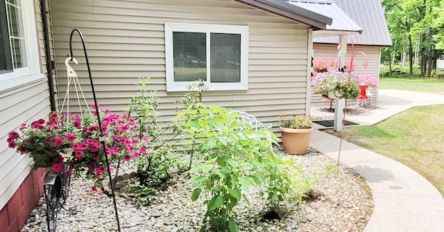 1308 Beaver Rd, Bitely, MI 49309 - view of side of property featuring metal roof