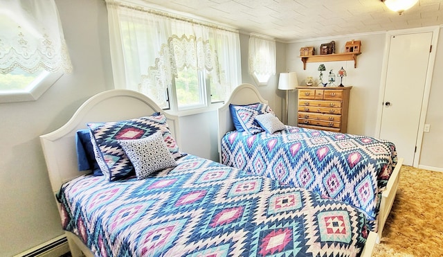 1308 Beaver Rd, Bitely, MI 49309 - carpeted bedroom with a baseboard heating unit