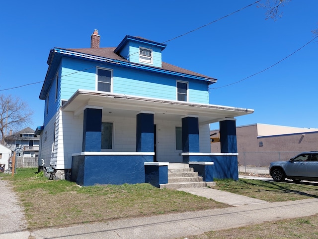 27 Rose St SW, Grand Rapids, MI 49507 - traditional style home featuring covered porch and a chimney