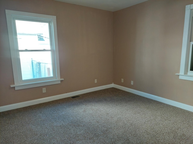 27 Rose St SW, Grand Rapids, MI 49507 - spare room with carpet flooring and baseboards