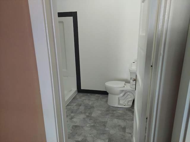 27 Rose St SW, Grand Rapids, MI 49507 - bathroom featuring toilet and a shower