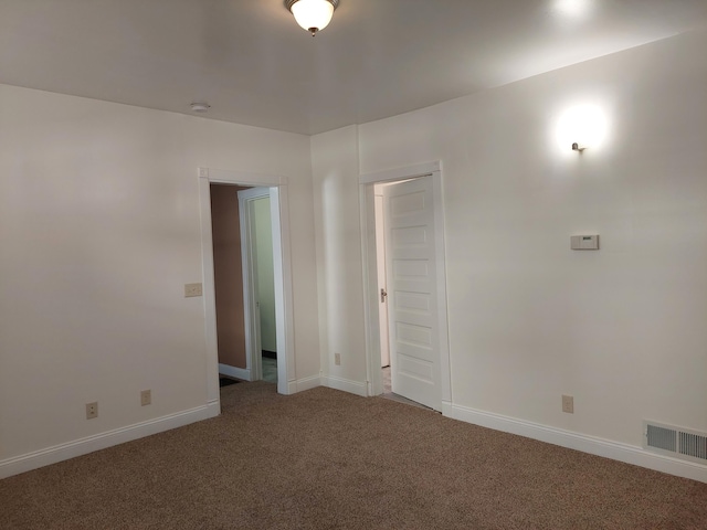 27 Rose St SW, Grand Rapids, MI 49507 - carpeted empty room with baseboards and a smoke detector