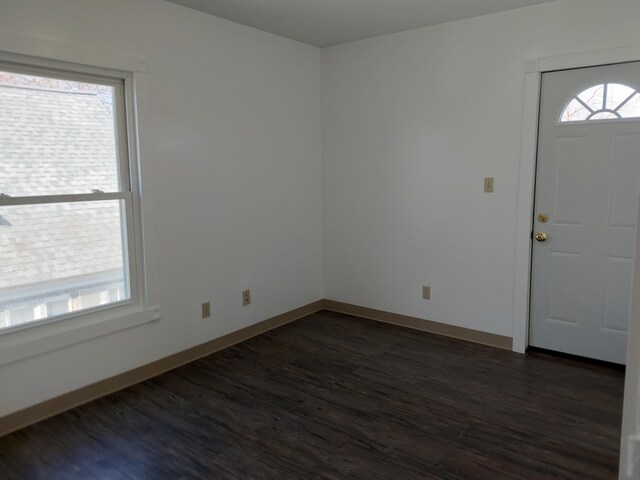 27 Rose St SW, Grand Rapids, MI 49507 - foyer featuring dark wood finished floors and baseboards