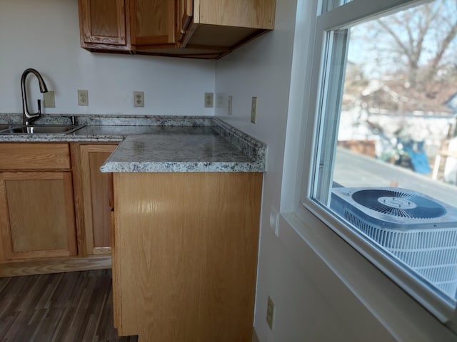 27 Rose St SW, Grand Rapids, MI 49507 - kitchen featuring a sink and dark wood-style flooring