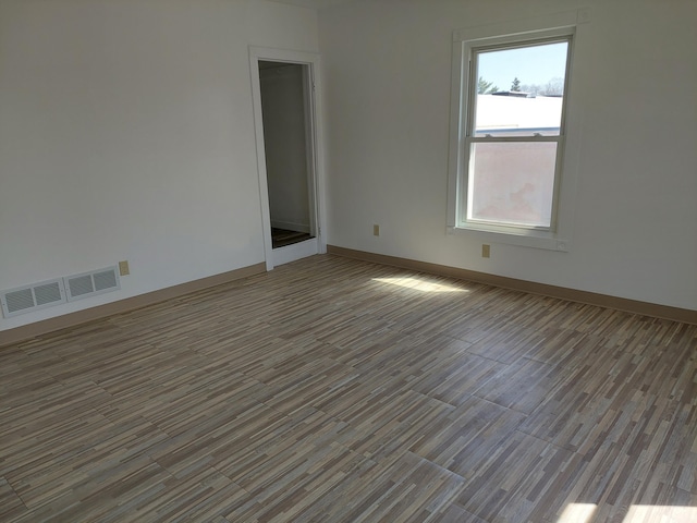 27 Rose St SW, Grand Rapids, MI 49507 - empty room with wood finished floors and baseboards