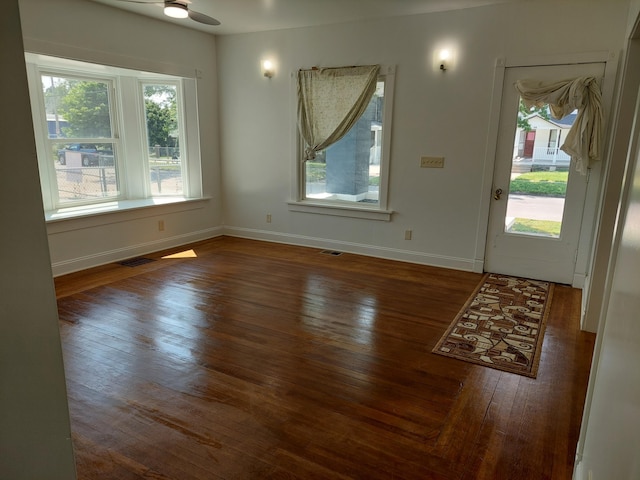 27 Rose St SW, Grand Rapids, MI 49507 - foyer featuring hardwood / wood-style floors, baseboards, and ceiling fan