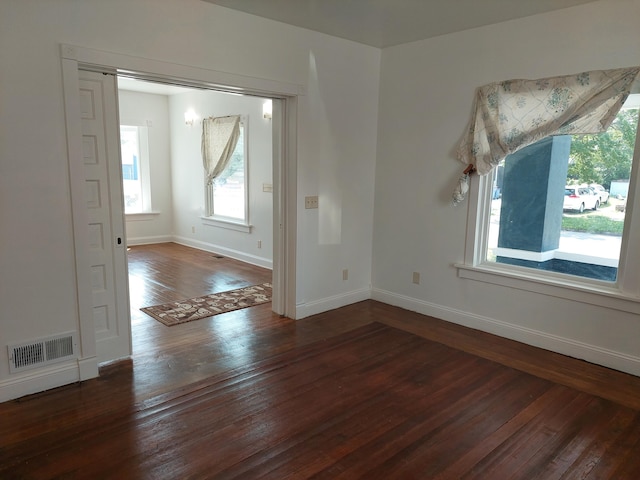 27 Rose St SW, Grand Rapids, MI 49507 - empty room featuring plenty of natural light, hardwood / wood-style floors, and baseboards