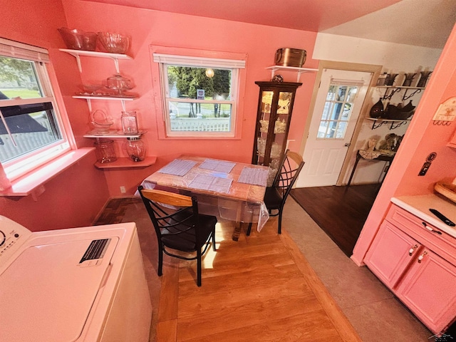 2093 California Ave, Bridgeport, MI 48601 - dining space featuring washer / clothes dryer and light wood-style flooring