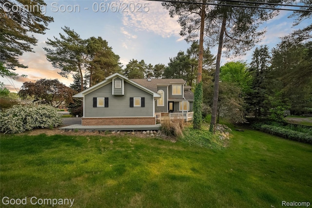 5490 Clarkston Rd, Clarkston, MI 48348 - back of property featuring a lawn and brick siding