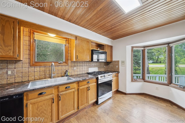 5490 Clarkston Rd, Clarkston, MI 48348 - kitchen with black appliances, a sink, wood ceiling, tasteful backsplash, and light wood-style floors