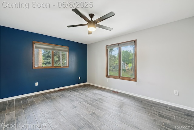 5490 Clarkston Rd, Clarkston, MI 48348 - empty room featuring a ceiling fan, wood finished floors, and baseboards