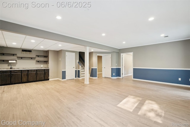 5490 Clarkston Rd, Clarkston, MI 48348 - unfurnished living room with baseboards, light wood finished floors, recessed lighting, stairway, and ornamental molding