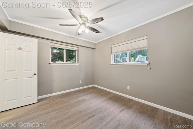 5490 Clarkston Rd, Clarkston, MI 48348 - unfurnished bedroom with light wood-style flooring, baseboards, ornamental molding, and a ceiling fan