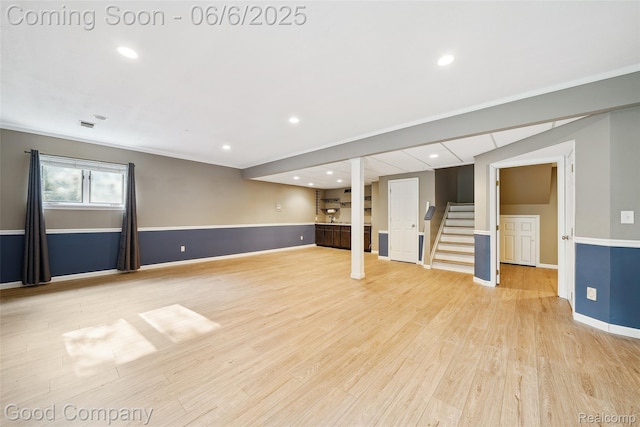 5490 Clarkston Rd, Clarkston, MI 48348 - below grade area featuring stairway, light wood-style flooring, baseboards, crown molding, and recessed lighting