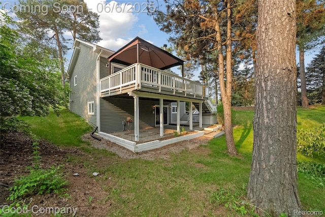 5490 Clarkston Rd, Clarkston, MI 48348 - rear view of house with a deck and a yard