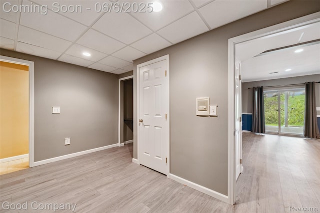 5490 Clarkston Rd, Clarkston, MI 48348 - corridor with light wood-type flooring, baseboards, recessed lighting, and a paneled ceiling