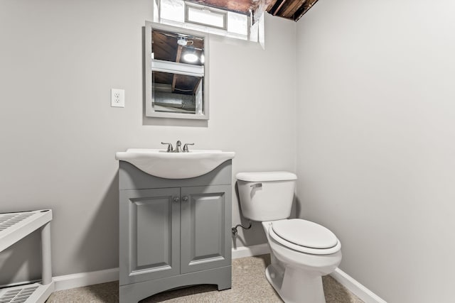 21850 Schroeder Ave, Eastpointe, MI 48021 - bathroom featuring baseboards, toilet, and vanity