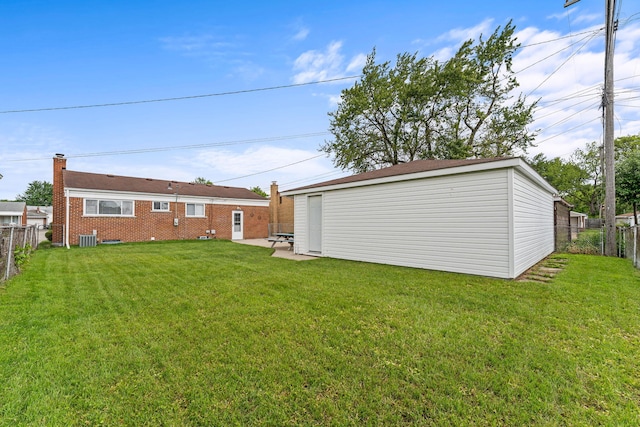 21850 Schroeder Ave, Eastpointe, MI 48021 - rear view of house with an outdoor structure, central AC, brick siding, a chimney, and a patio area