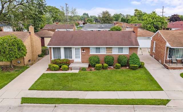 21850 Schroeder Ave, Eastpointe, MI 48021 - view of front facade featuring brick siding, a front lawn, and a garage