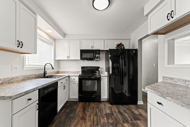 21850 Schroeder Ave, Eastpointe, MI 48021 - kitchen featuring black appliances, a sink, dark wood-style flooring, white cabinets, and light countertops