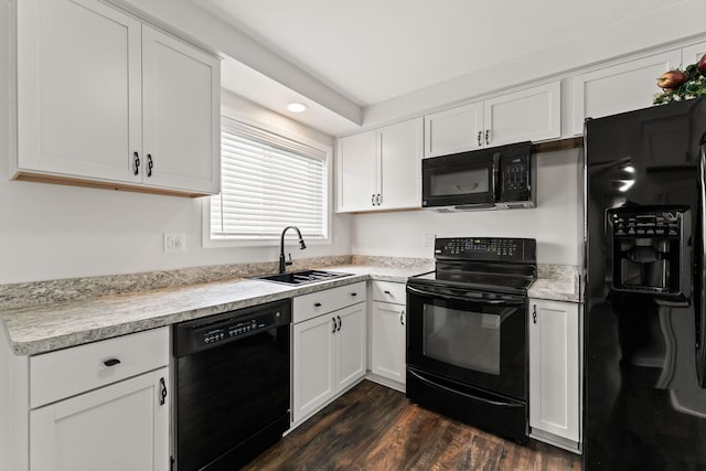 21850 Schroeder Ave, Eastpointe, MI 48021 - kitchen with black appliances, a sink, white cabinetry, dark wood-type flooring, and recessed lighting