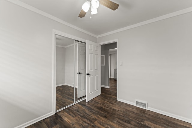 21850 Schroeder Ave, Eastpointe, MI 48021 - unfurnished bedroom with dark wood-style floors, baseboards, a closet, a ceiling fan, and crown molding