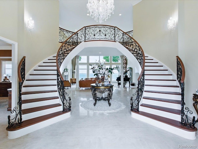 4326 Gratiot Ave, Port Huron, MI 48060 - stairs with arched walkways, a high ceiling, and a chandelier