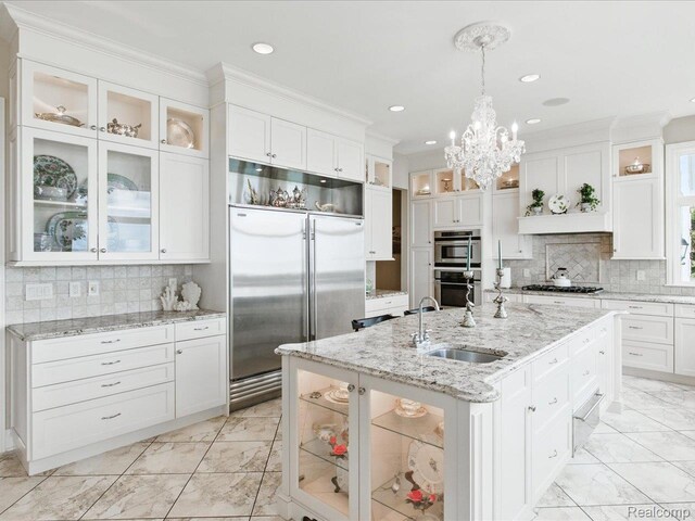 4326 Gratiot Ave, Port Huron, MI 48060 - kitchen featuring stainless steel appliances, a sink, light marble finish floors, white cabinetry, and ornamental molding