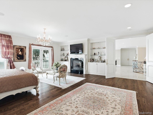 4326 Gratiot Ave, Port Huron, MI 48060 - bedroom featuring wood finished floors, a chandelier, a glass covered fireplace, recessed lighting, and ornamental molding