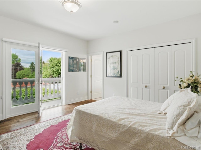 4326 Gratiot Ave, Port Huron, MI 48060 - bedroom with access to outside, wood finished floors, a closet, and baseboards