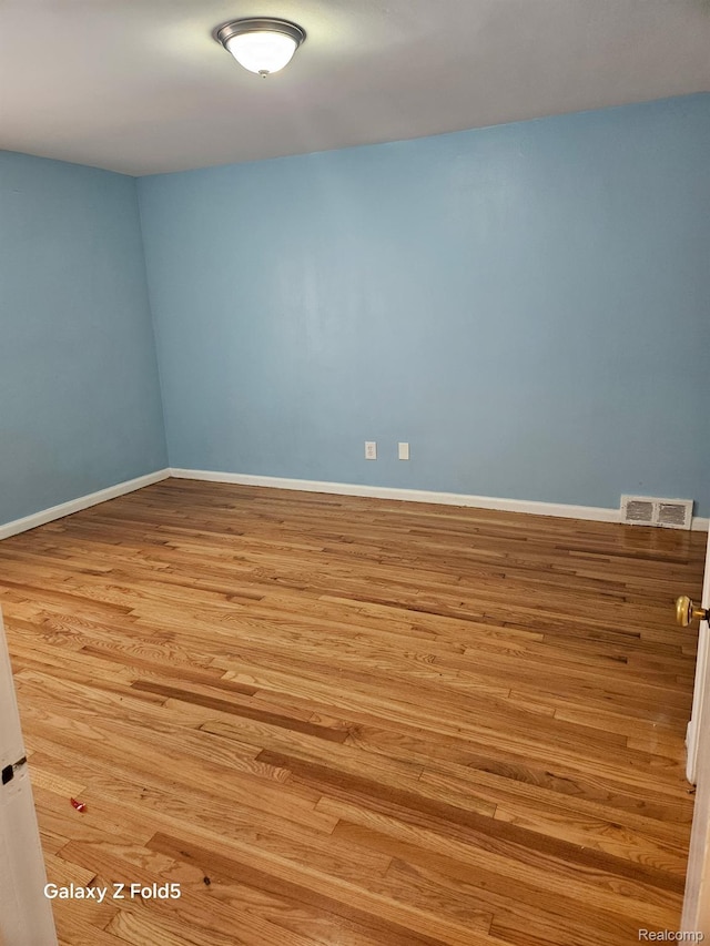 18941 Puritan St, Detroit, MI 48223 - unfurnished room with wood finished floors and baseboards