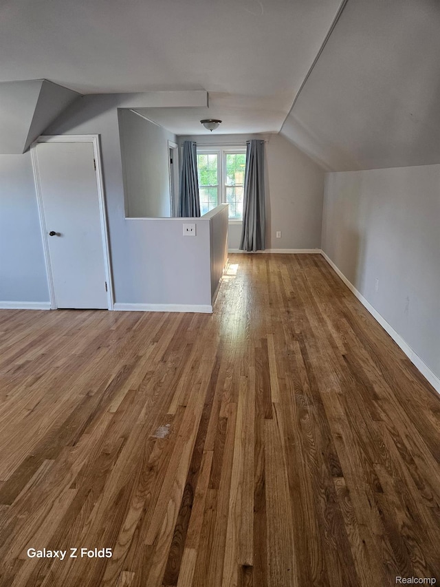 18941 Puritan St, Detroit, MI 48223 - additional living space featuring wood finished floors, lofted ceiling, and baseboards