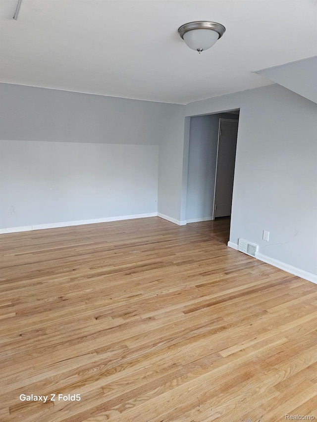 18941 Puritan St, Detroit, MI 48223 - spare room featuring baseboards and light wood-style floors
