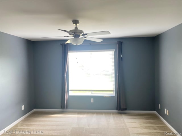 29337 Woodpark Cir Unit 60, Warren, MI 48092 - spare room featuring ceiling fan and light carpet
